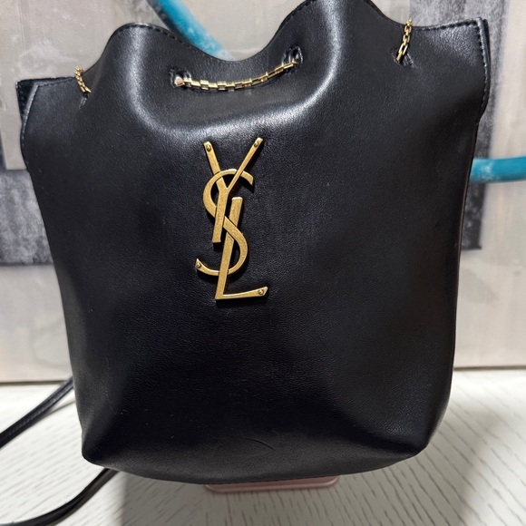 Yves Saint Laurent Handbags - Yves Saint Laurent Black Leather Bucket Shoulder Bag with Gold YSL Emblem
